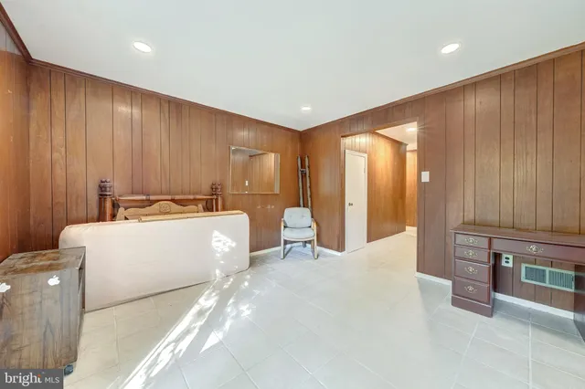 a large bedroom with a large bed and furniture