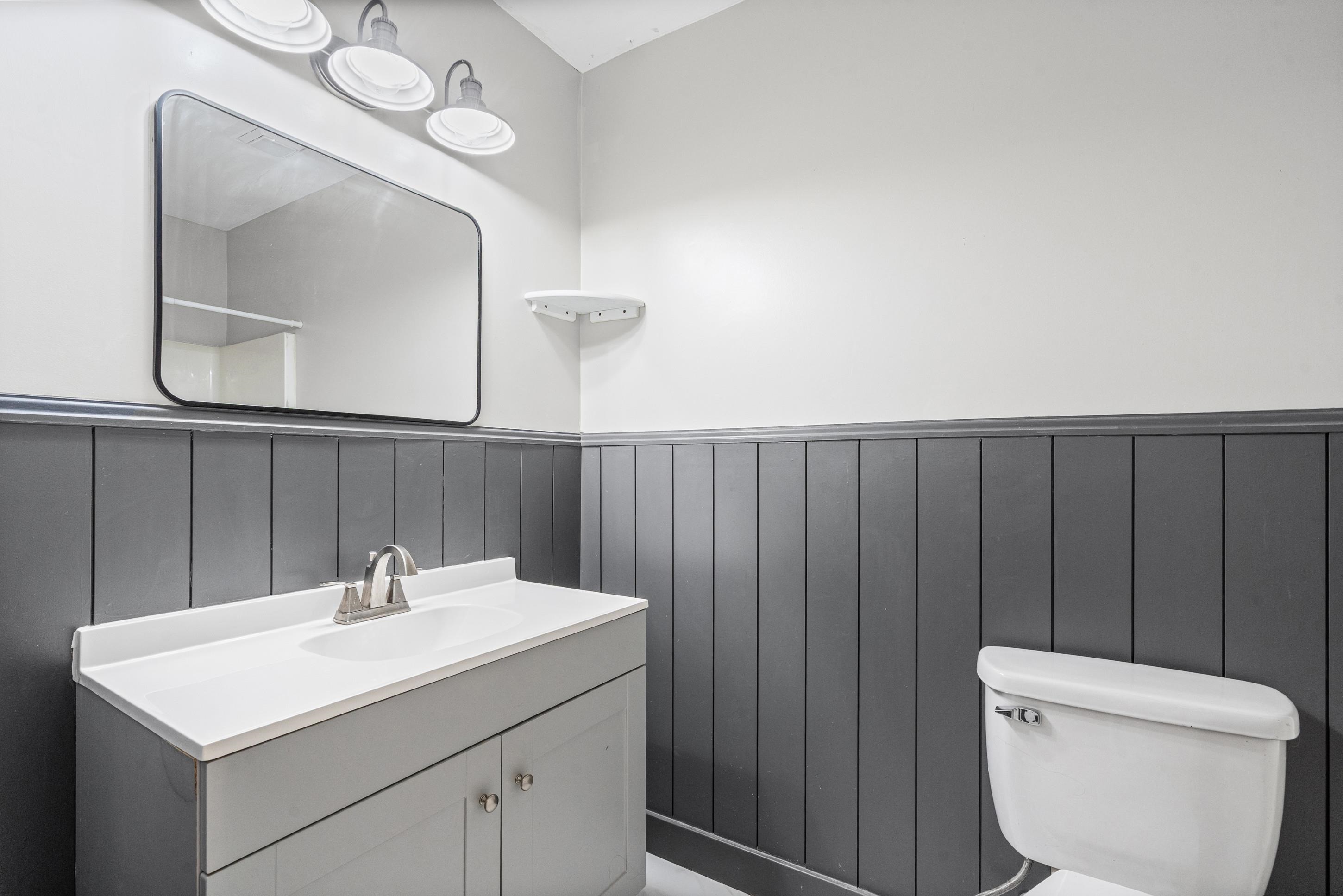 511 Rae Drive Munford, TN 38058 - Photo 15 of 30 Half bathroom featuring vanity and wainscoting