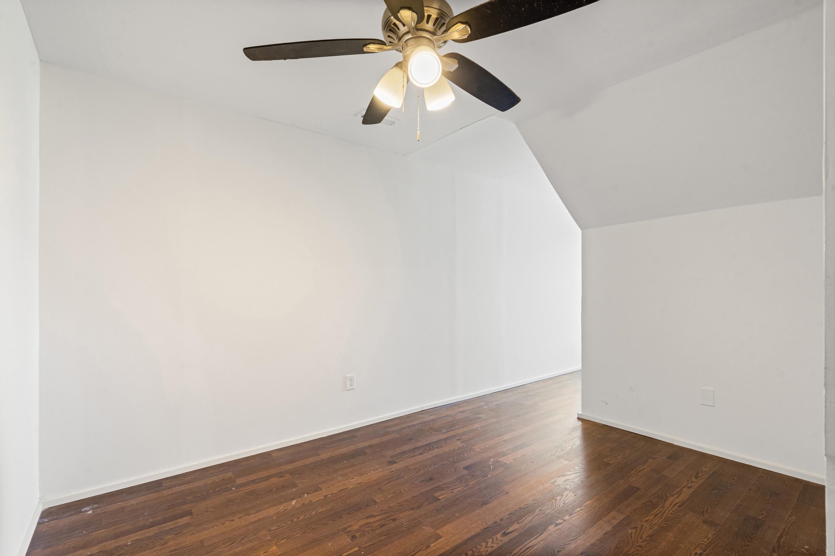 511 Rae Drive Munford, TN 38058 - Photo 17 of 30 Additional living space with lofted ceiling, dark wood-style flooring, and a ceiling fan