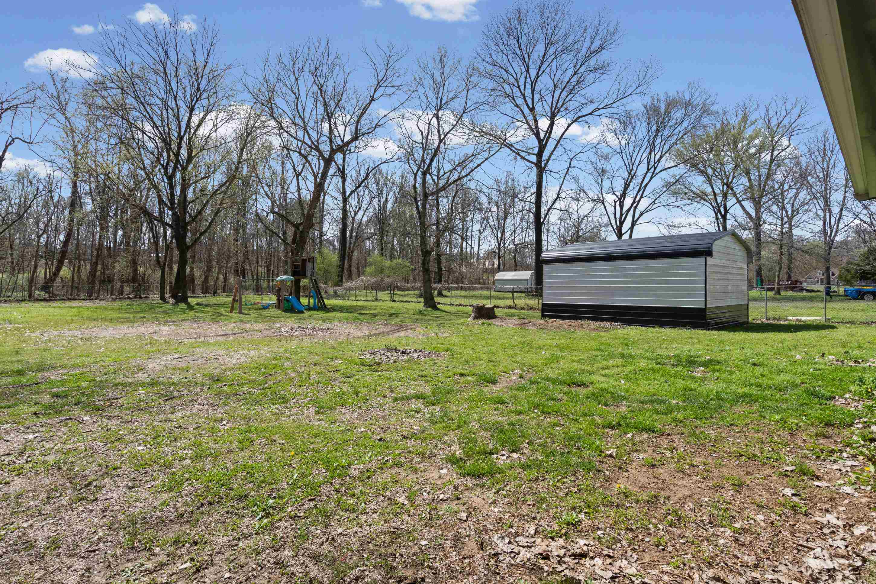511 Rae Drive Munford, TN 38058 - Photo 22 of 30 View of yard with a playground and an outbuilding