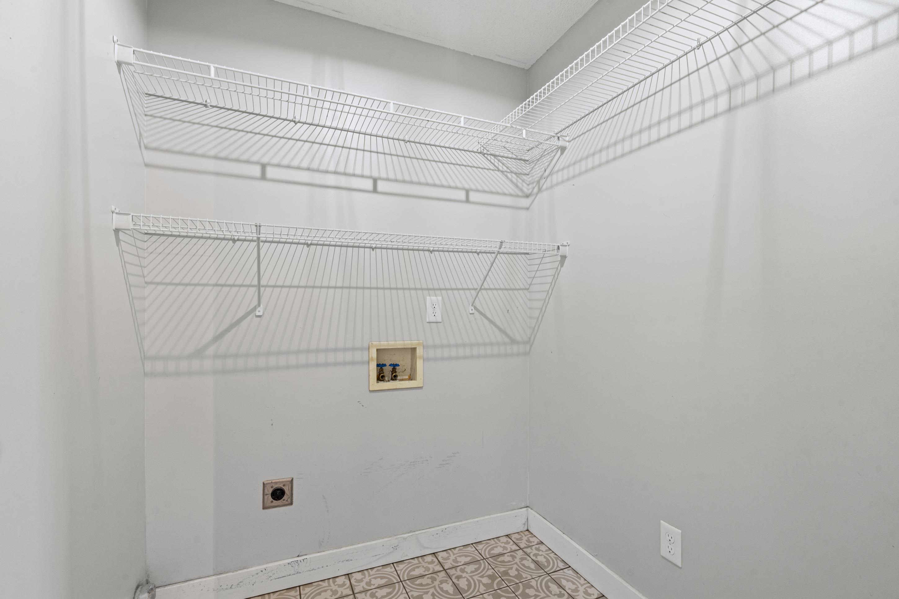 511 Rae Drive Munford, TN 38058 - Photo 9 of 30 Laundry room featuring washer hookup, electric dryer hookup, and light flooring