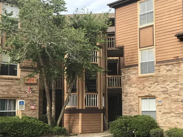 a view of a house with a tree