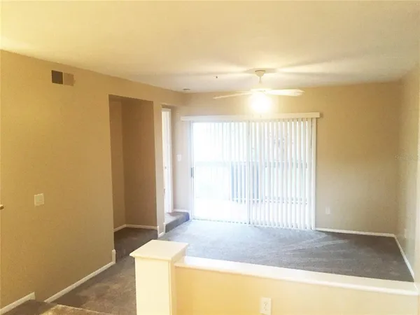 a view of an empty room and window