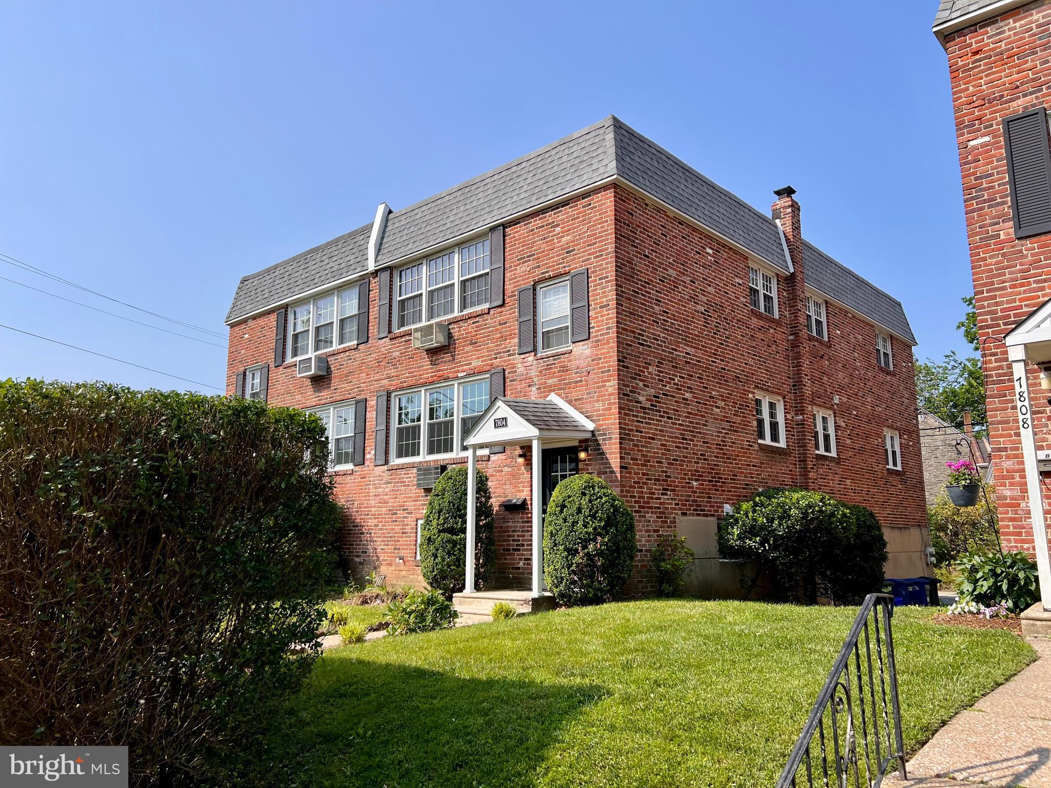 7804 Winston Road, Unit 1 Philadelphia, PA 19118 - Photo 2 of 13 a front view of a house with yard
