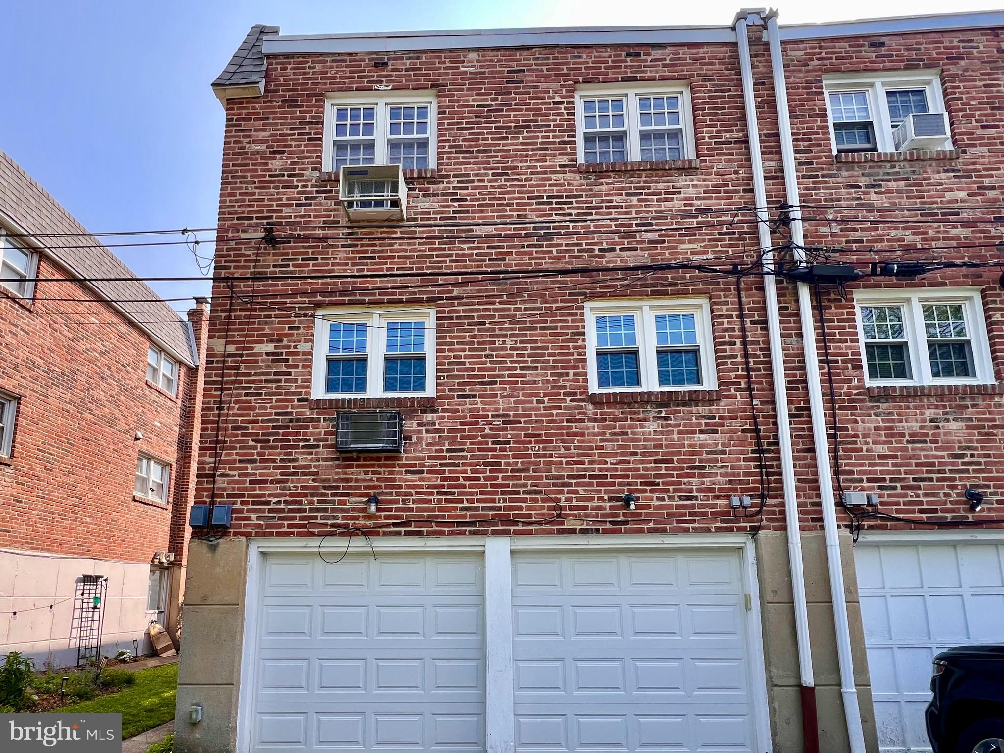 7804 Winston Road, Unit 1 Philadelphia, PA 19118 - Photo 3 of 13 a building view with a brick wall