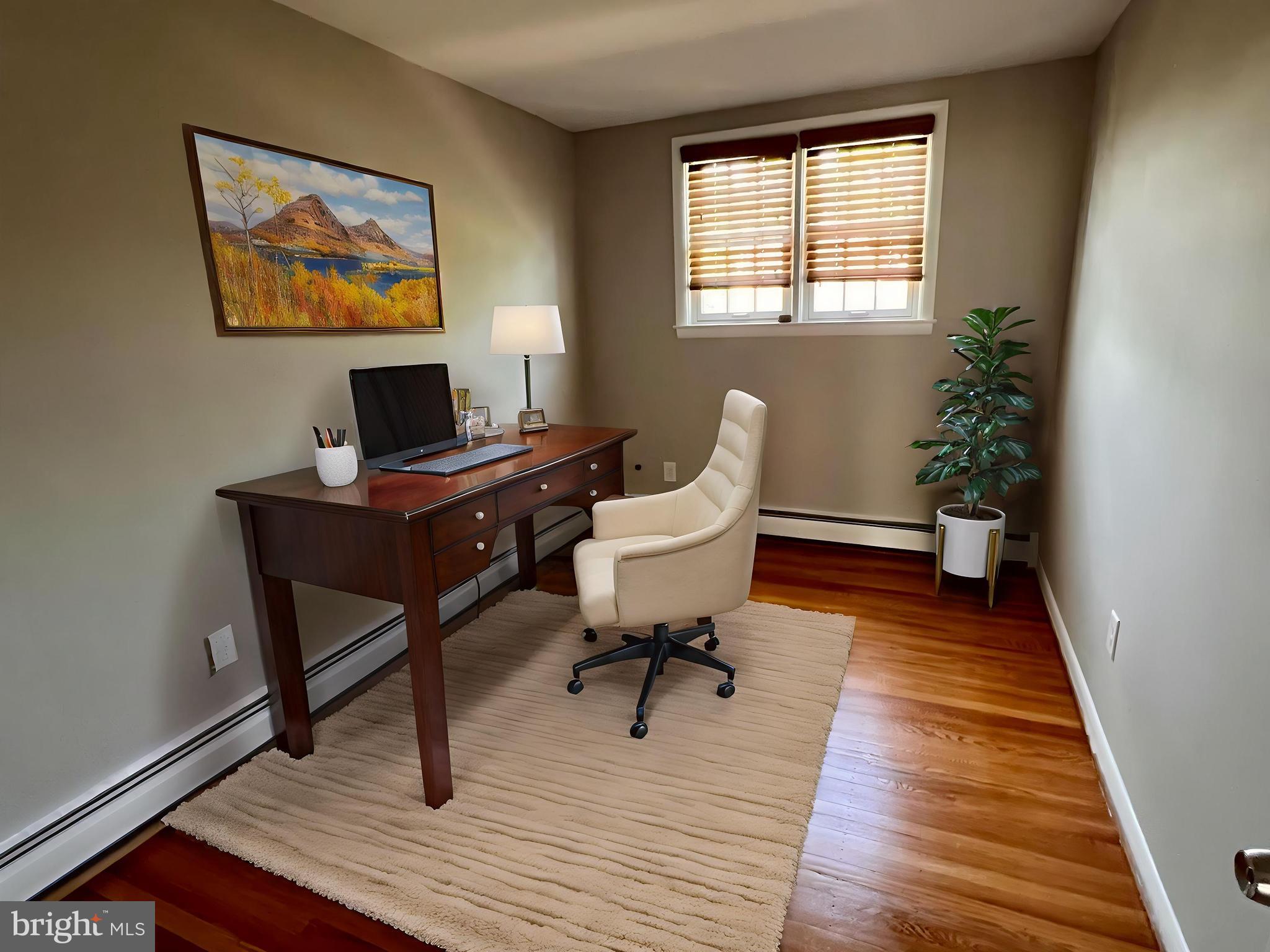 7804 Winston Road, Unit 1 Philadelphia, PA 19118 - Photo 10 of 13 a view of a workspace with furniture and wooden floor