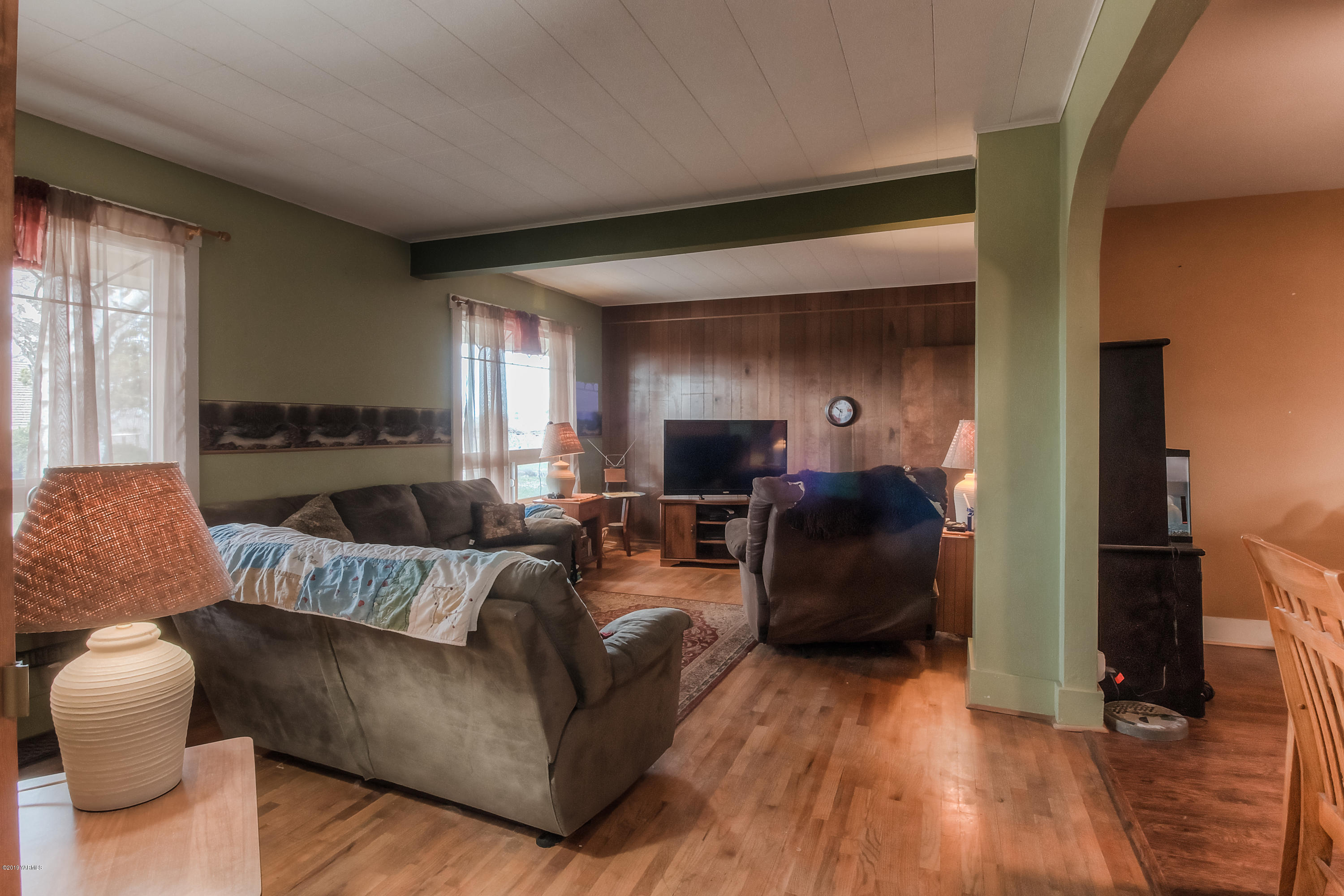 111 Beam Road Granger, WA 98932 - Photo 12 of 27 a living room with furniture and a wooden floor