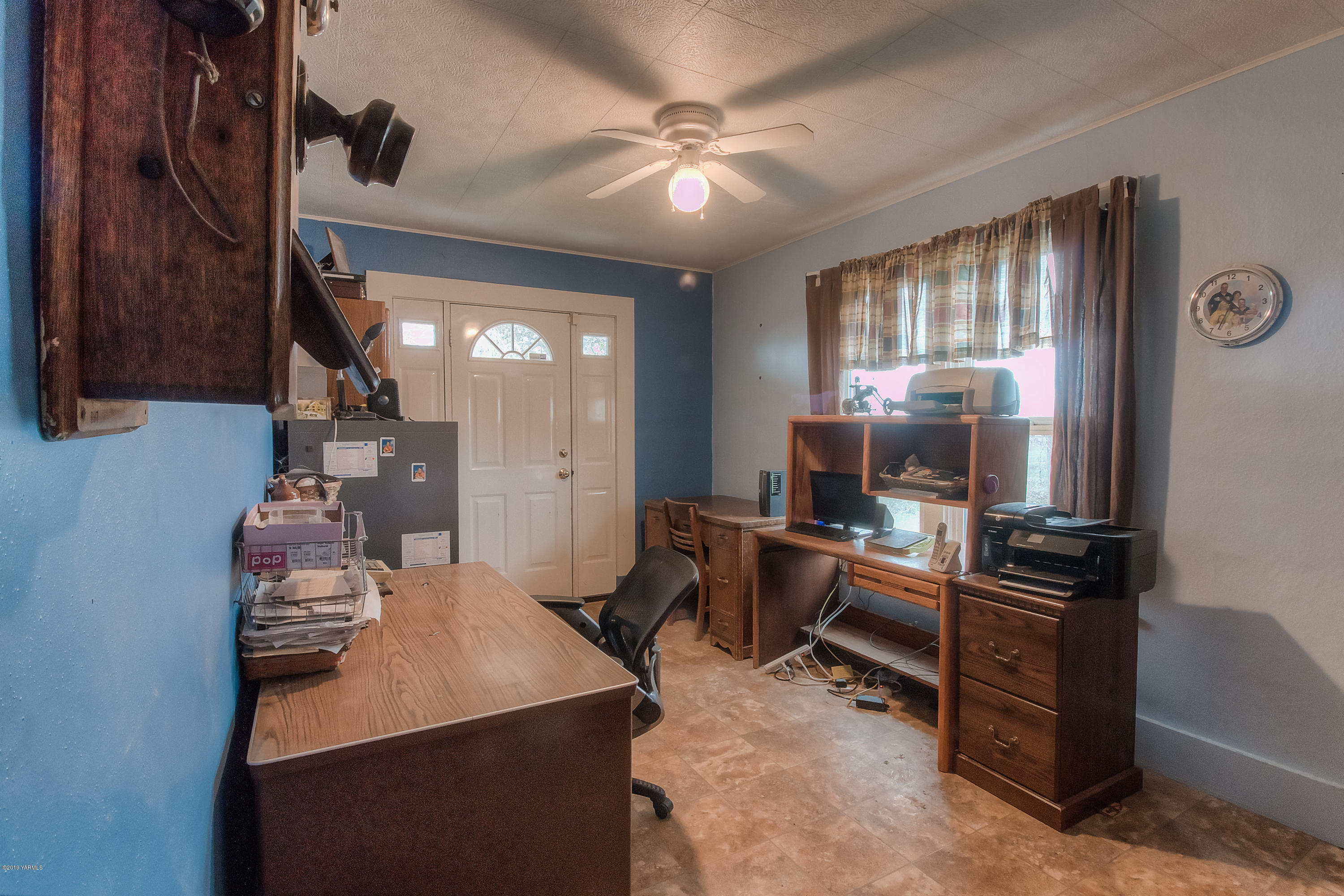 111 Beam Road Granger, WA 98932 - Photo 13 of 27 a view of a workspace with furniture and a window