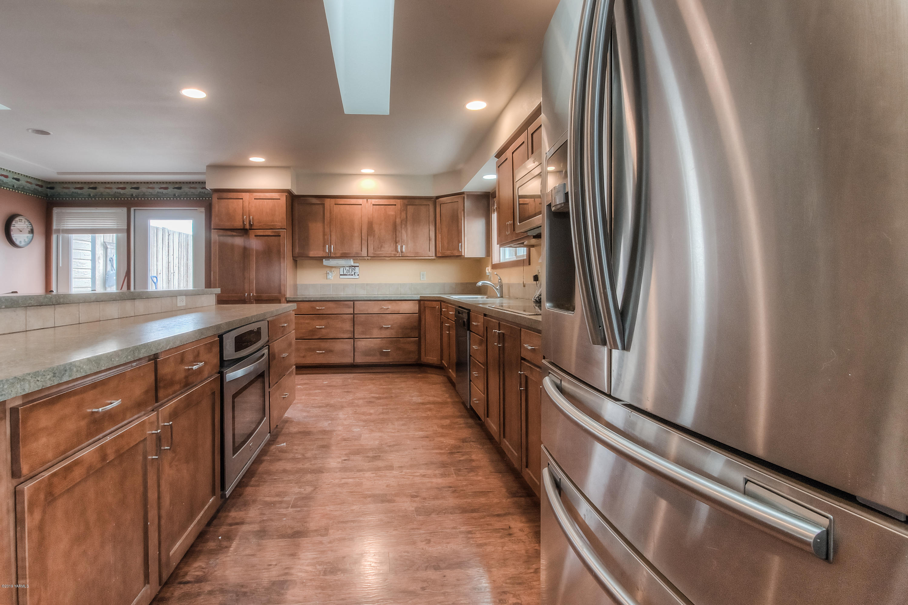 111 Beam Road Granger, WA 98932 - Photo 3 of 27 a kitchen with stainless steel appliances granite countertop a refrigerator and a sink