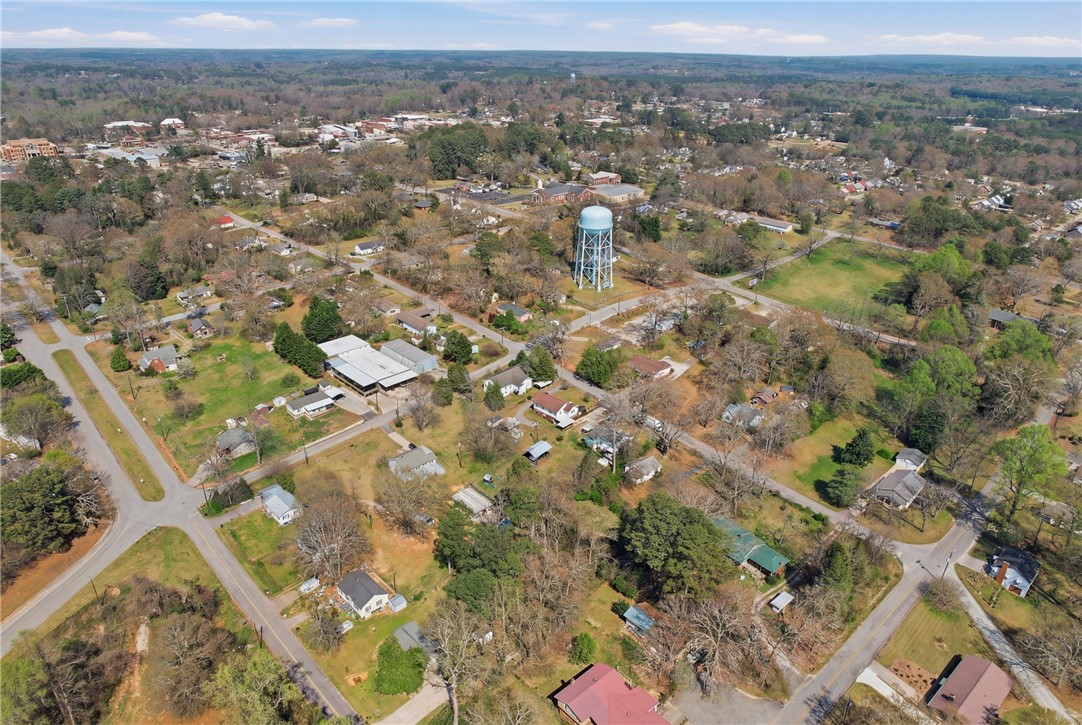 602 South Tugaloo Street Walhalla, SC 29691 - Photo 37 of 39 An aerial perspective reveals a vibrant community nestled among lush greenery and open spaces.