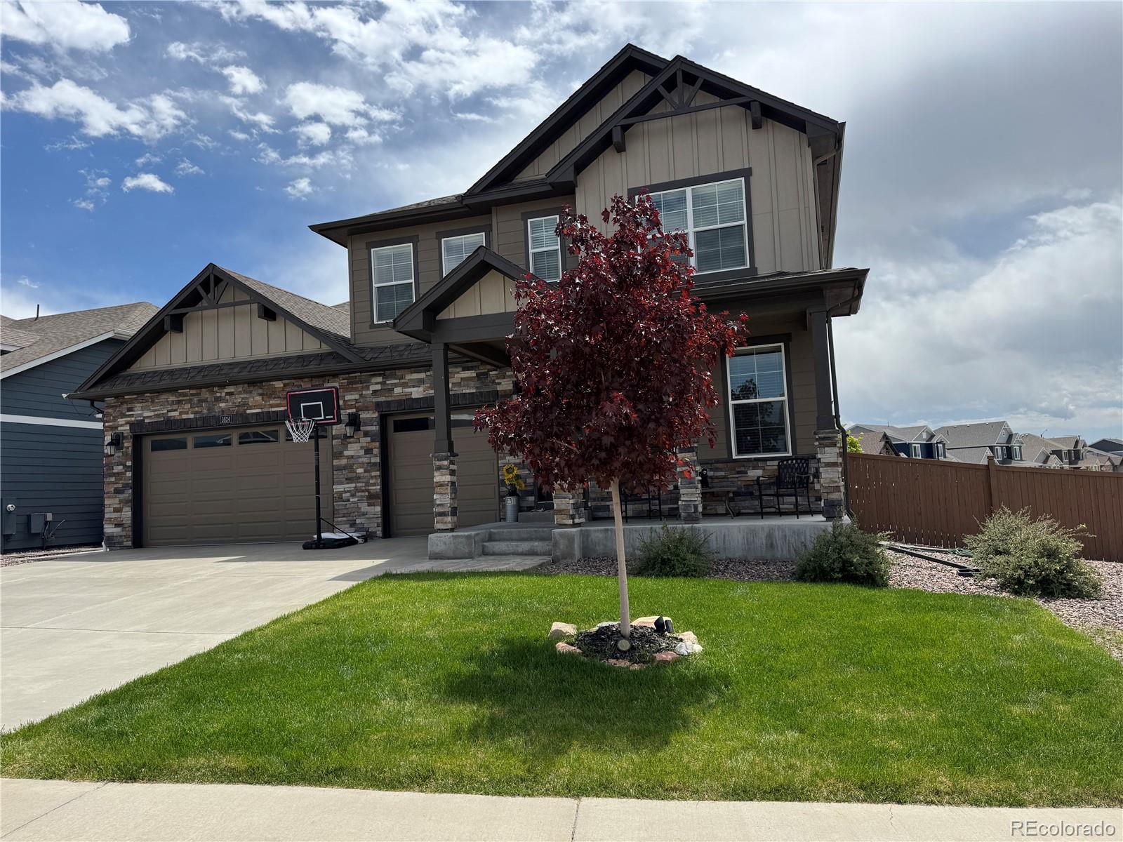 1624 Pinion Wing Circle Castle Rock, CO 80108 - Photo 1 of 47 a front view of a house with a yard and trees