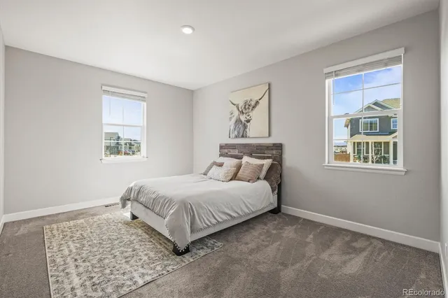 a view of a room with chairs and table in a room