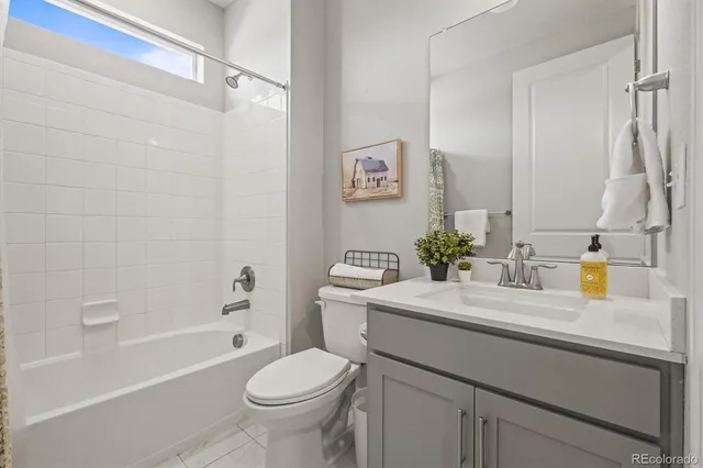 a bathroom with a sink a mirror and shower