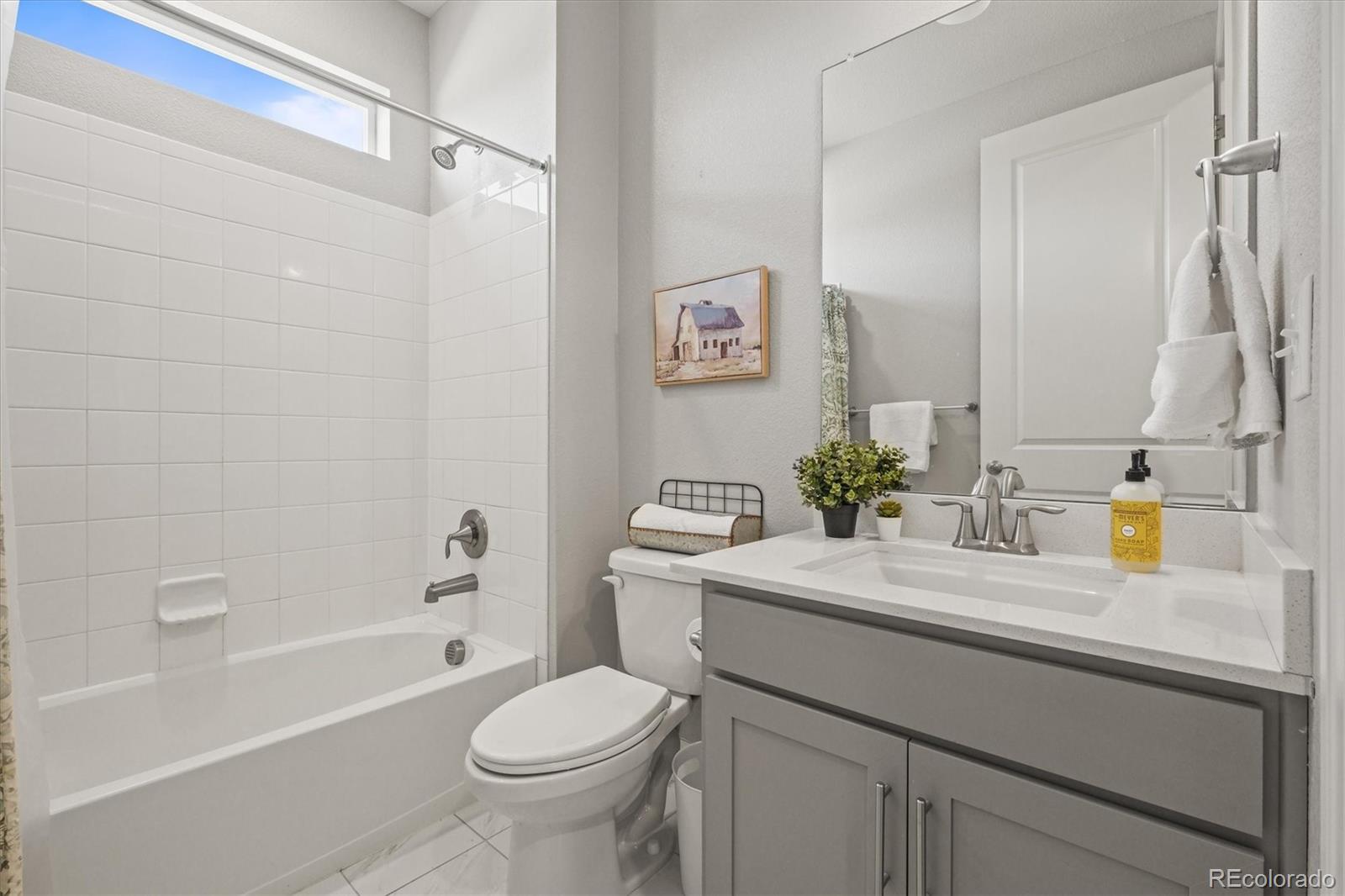 1624 Pinion Wing Circle Castle Rock, CO 80108 - Photo 16 of 47 a bathroom with a sink a toilet and shower