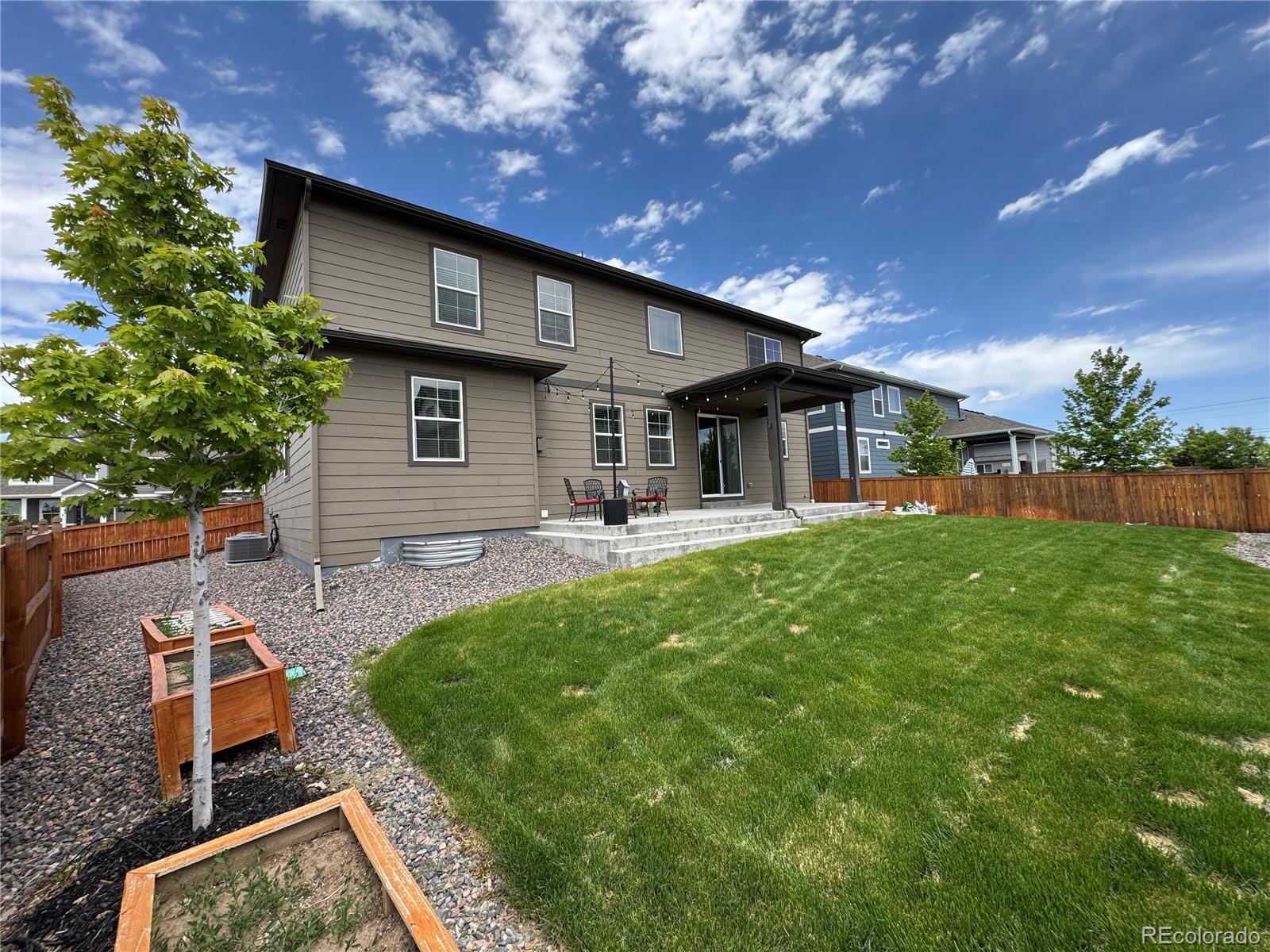 1624 Pinion Wing Circle Castle Rock, CO 80108 - Photo 19 of 47 a front view of a house with garden