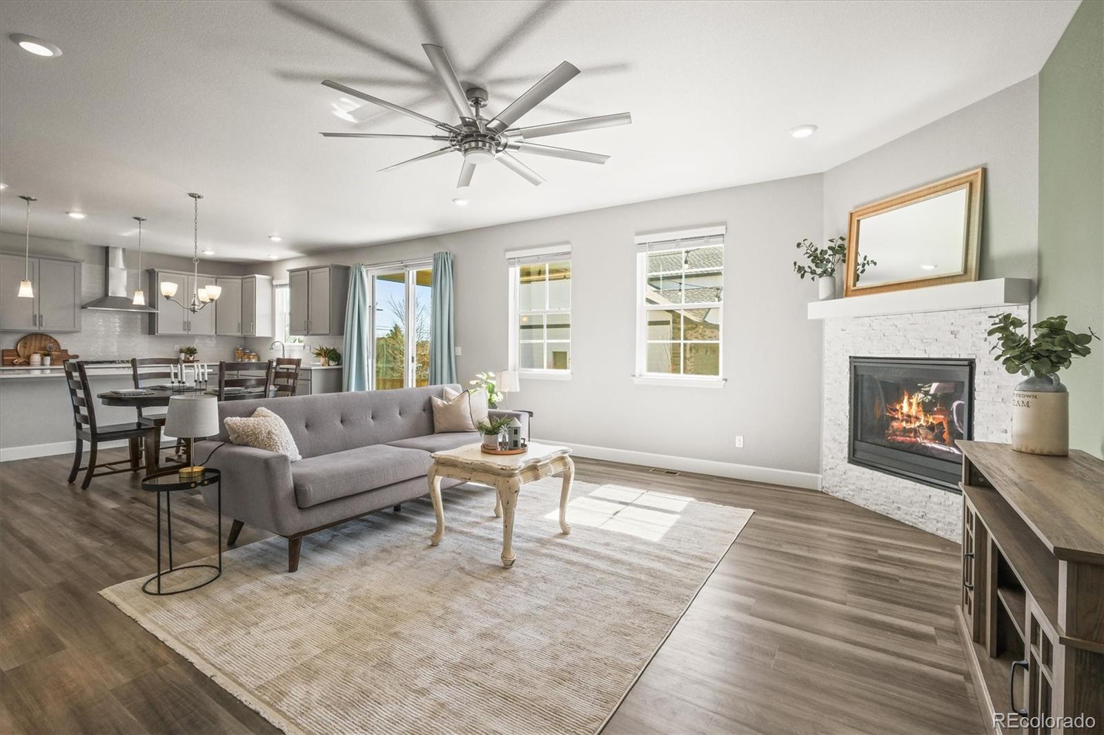 1624 Pinion Wing Circle Castle Rock, CO 80108 - Photo 2 of 47 a living room with furniture and a fireplace