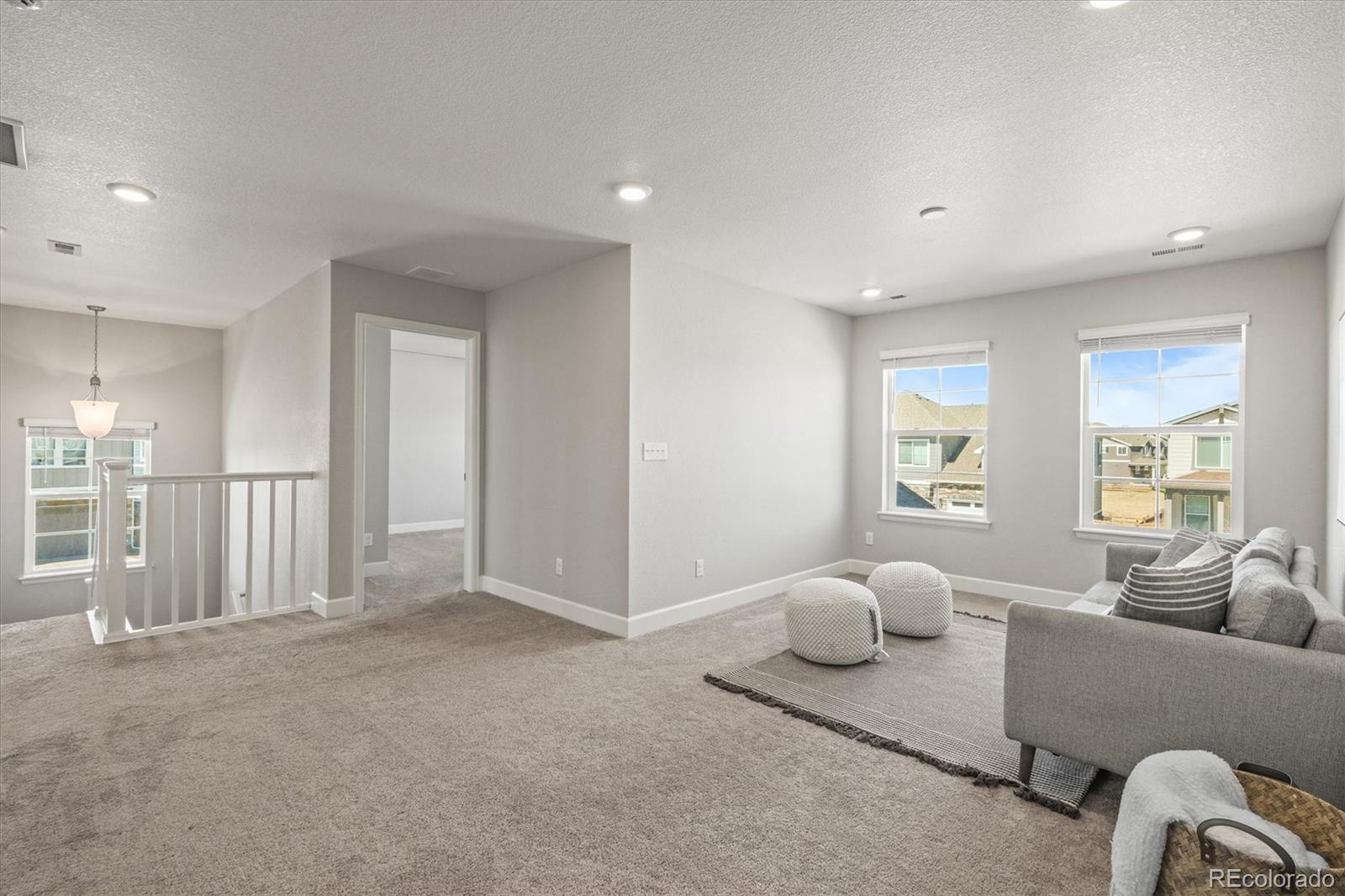 1624 Pinion Wing Circle Castle Rock, CO 80108 - Photo 22 of 47 a living room with furniture and a large window