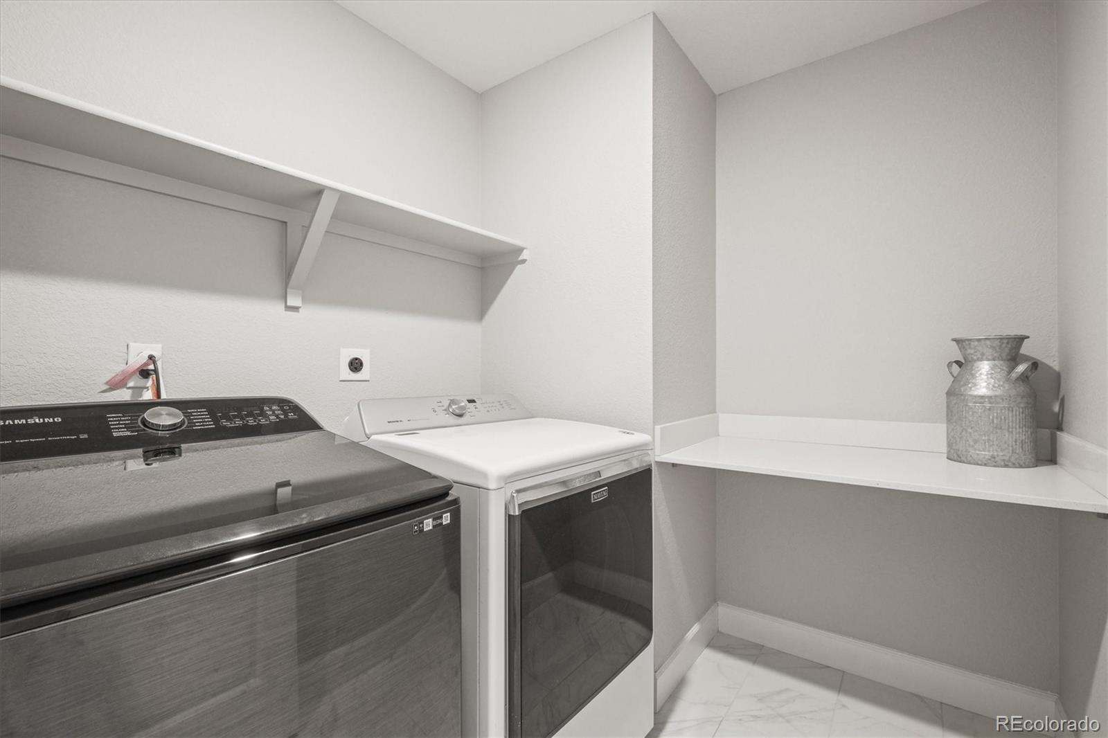 1624 Pinion Wing Circle Castle Rock, CO 80108 - Photo 33 of 47 a utility room with dryer and washer