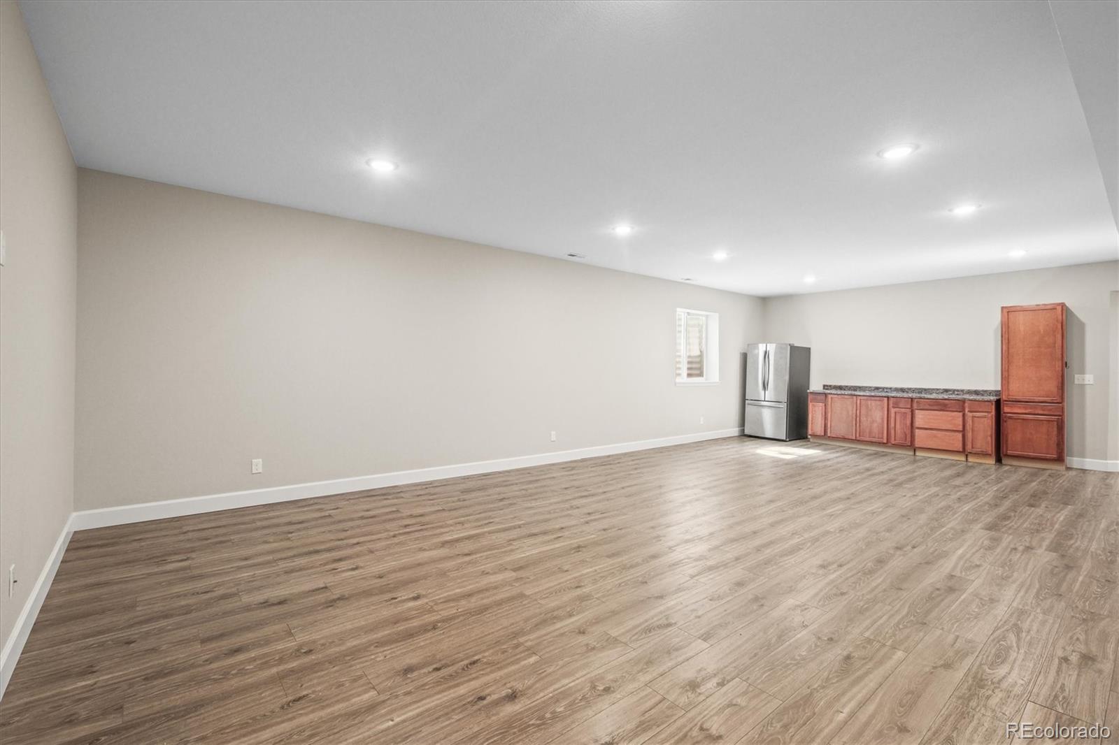 1624 Pinion Wing Circle Castle Rock, CO 80108 - Photo 38 of 47 a view of empty room with wooden floor