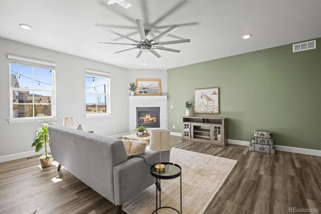 a kitchen with stainless steel appliances a refrigerator a sink and a stove