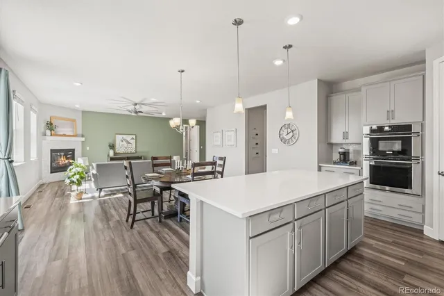 a kitchen with stainless steel appliances a sink stove and cabinets