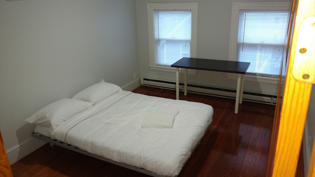 12 Bennett Street, Unit 3 Boston, MA 02135 - Photo 12 of 17 a bedroom with a bed and window