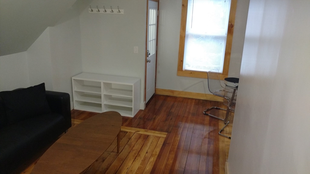 12 Bennett Street, Unit 3 Boston, MA 02135 - Photo 8 of 17 a view of walk in closet with clothes and shoes
