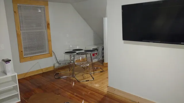 a dining room with table and chairs