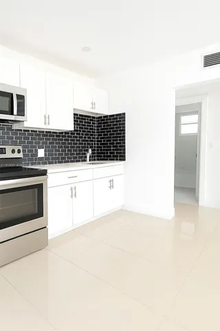 a bathroom with a bathtub and a sink