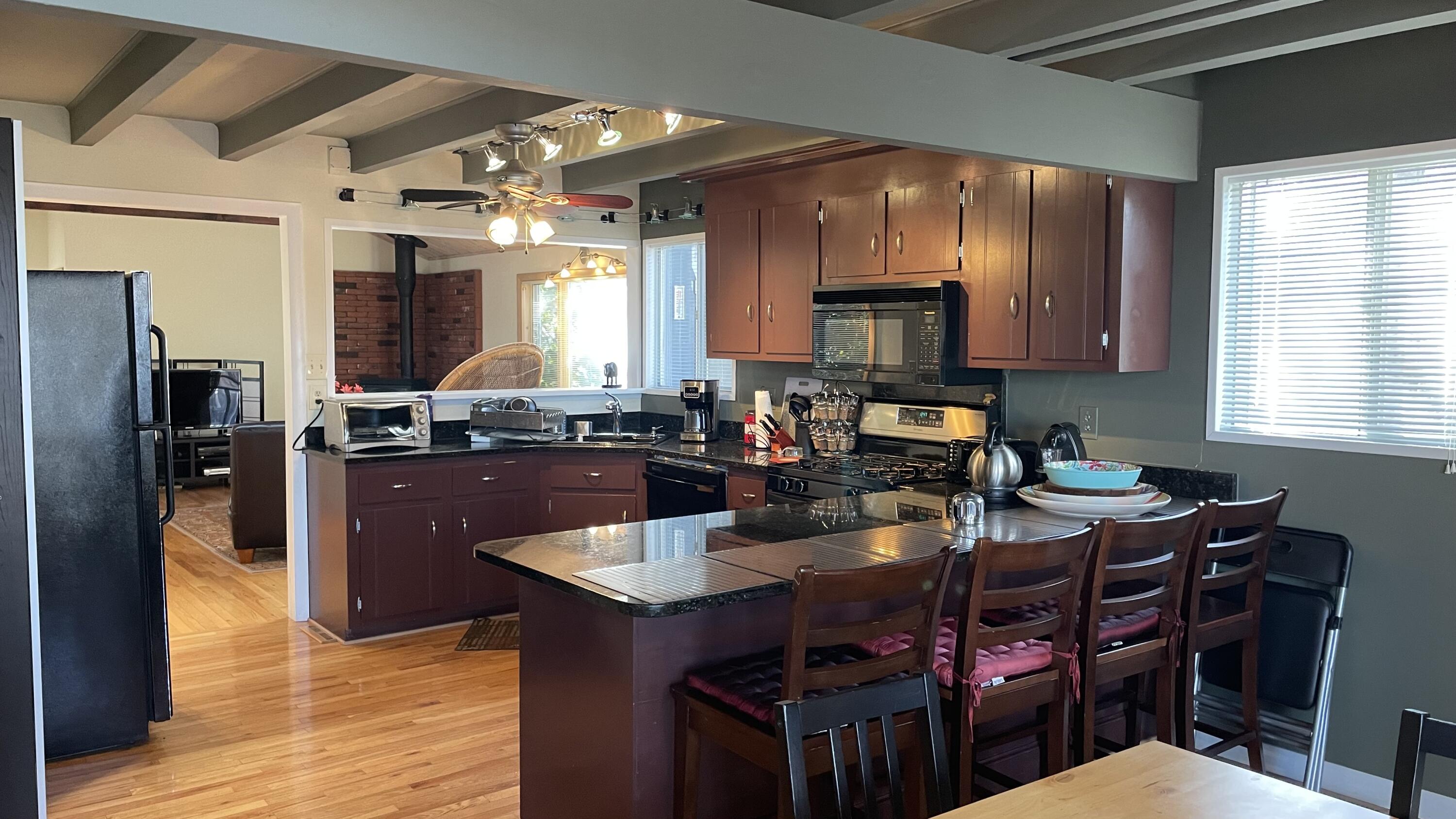 1 Summersea Road Mashpee, MA 02649 - Photo 13 of 34 a kitchen with a sink cabinets and wooden floor