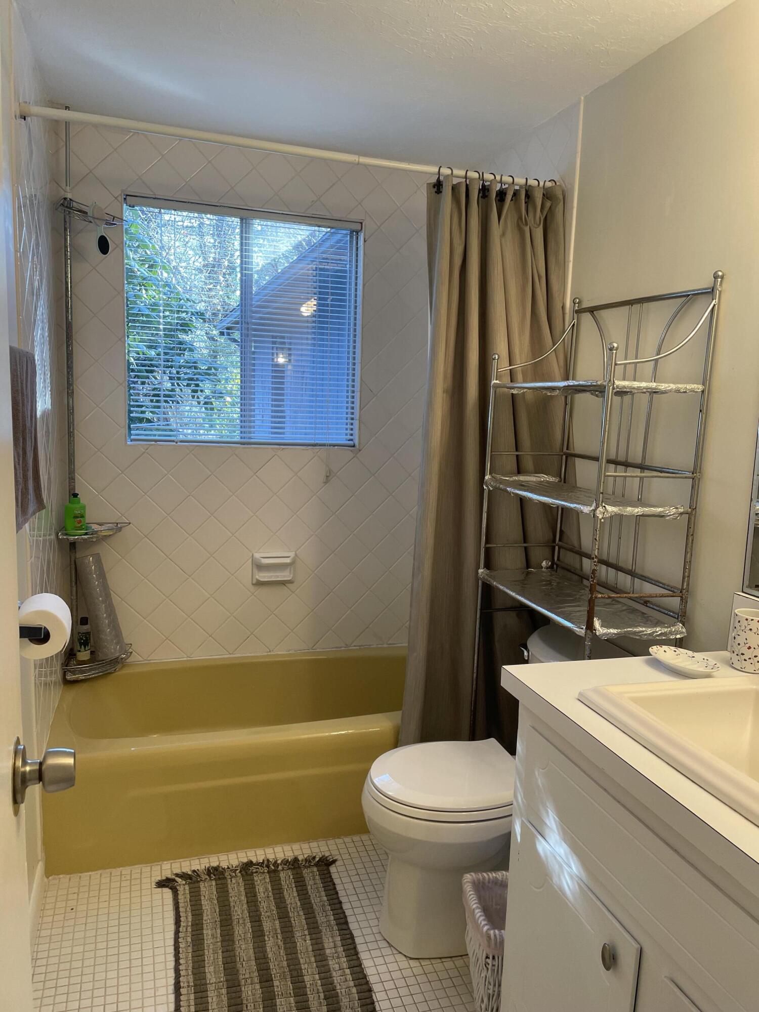 1 Summersea Road Mashpee, MA 02649 - Photo 27 of 34 a bathroom with a sink a toilet and bathtub