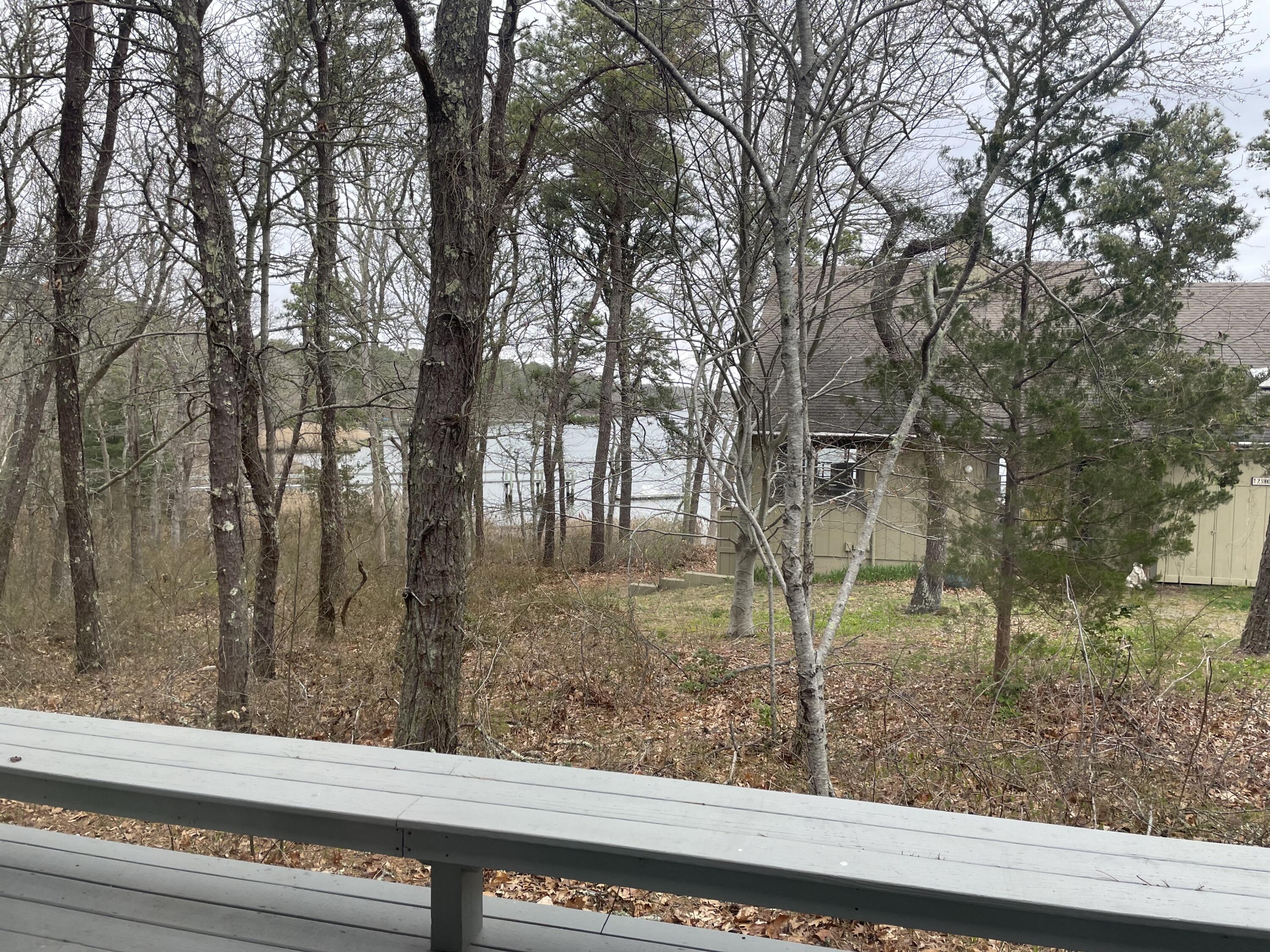 1 Summersea Road Mashpee, MA 02649 - Photo 4 of 34 a view of a yard from a window