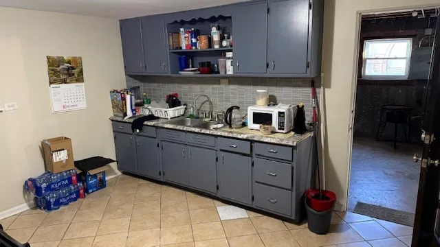 a kitchen with stainless steel appliances granite countertop a sink dishwasher stove and cabinets