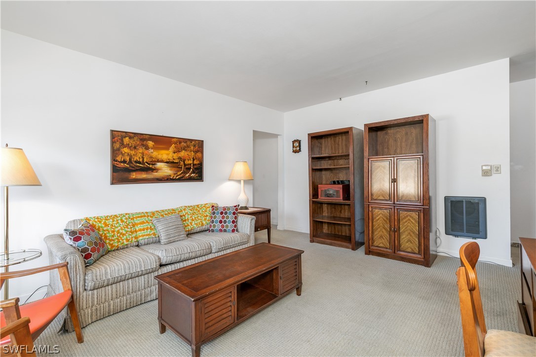 2544 First Street, Unit 201 Fort Myers, FL 33901 - Photo 11 of 19 a living room with furniture and a flat screen tv