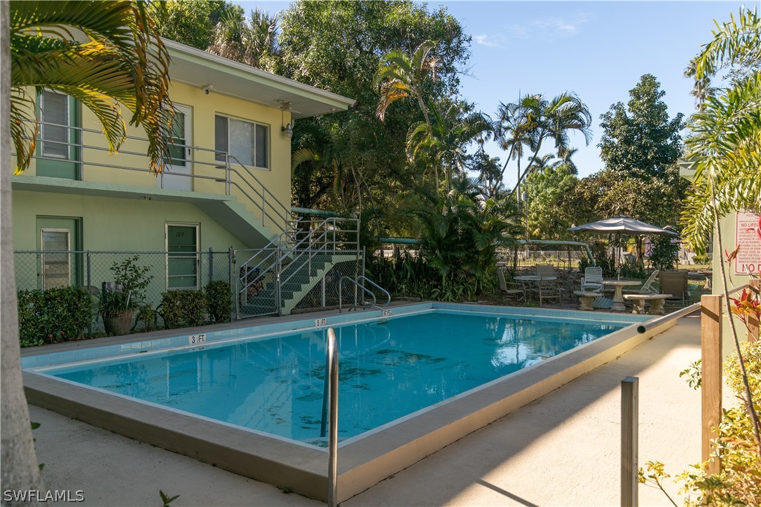 2544 First Street, Unit 201 Fort Myers, FL 33901 - Photo 16 of 19 a view of a small pool with a yard