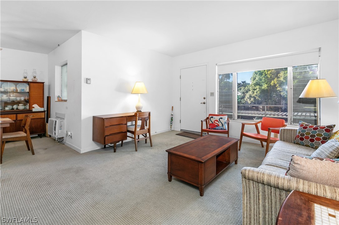 2544 First Street, Unit 201 Fort Myers, FL 33901 - Photo 9 of 19 a living room with furniture and a window