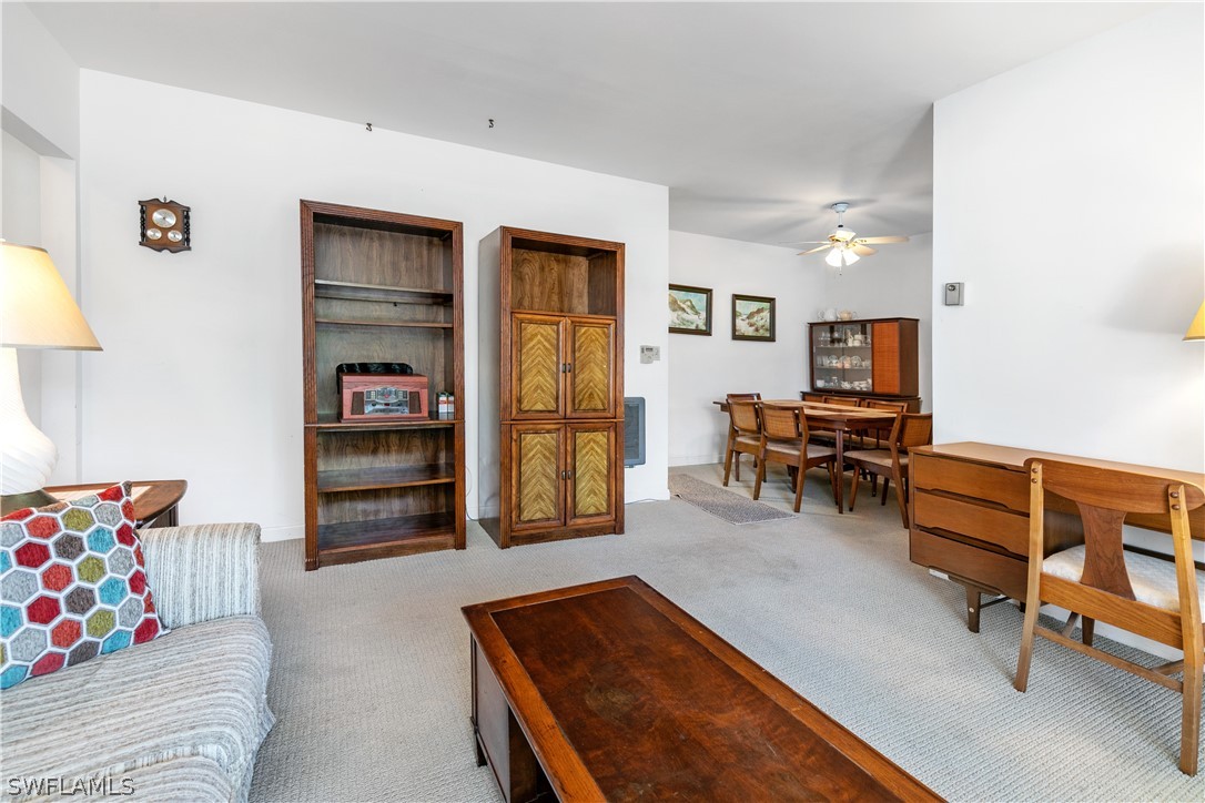 2544 First Street, Unit 201 Fort Myers, FL 33901 - Photo 10 of 19 a room with furniture and a wooden floor