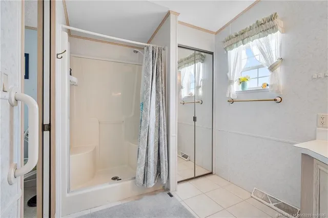 a bathroom with a bathtub and shower