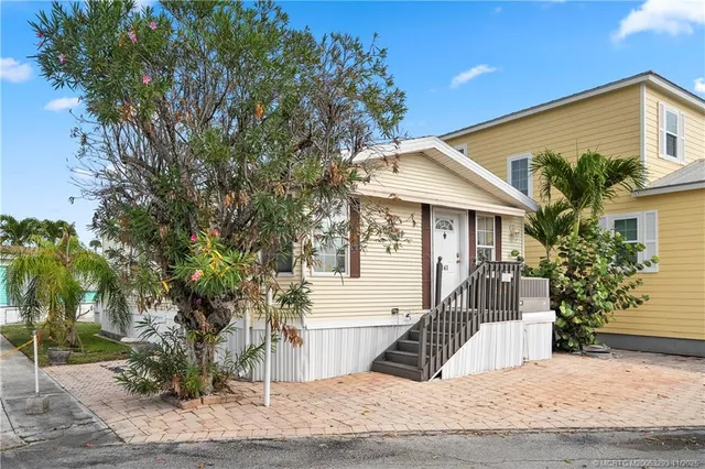 a view of a house with a tree