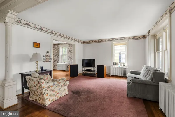 a living room with furniture and a flat screen tv