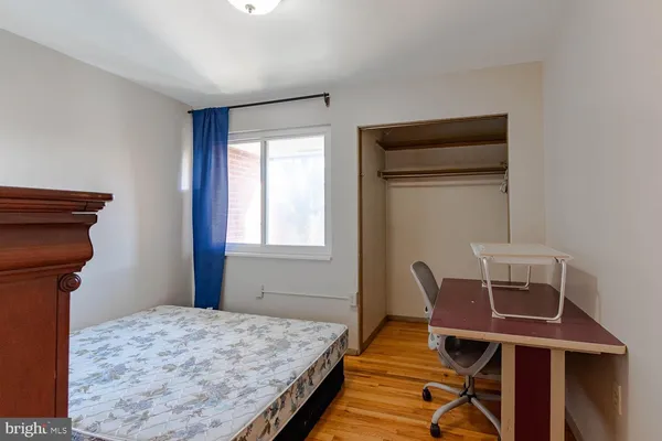 a bed room with a bed and a window