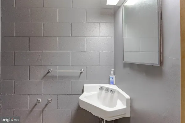 a bathroom with a sink and mirror