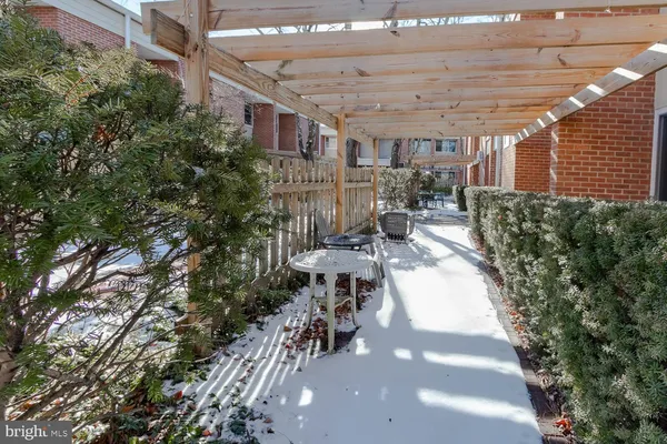 a view of a patio with table and chairs and potted plants
