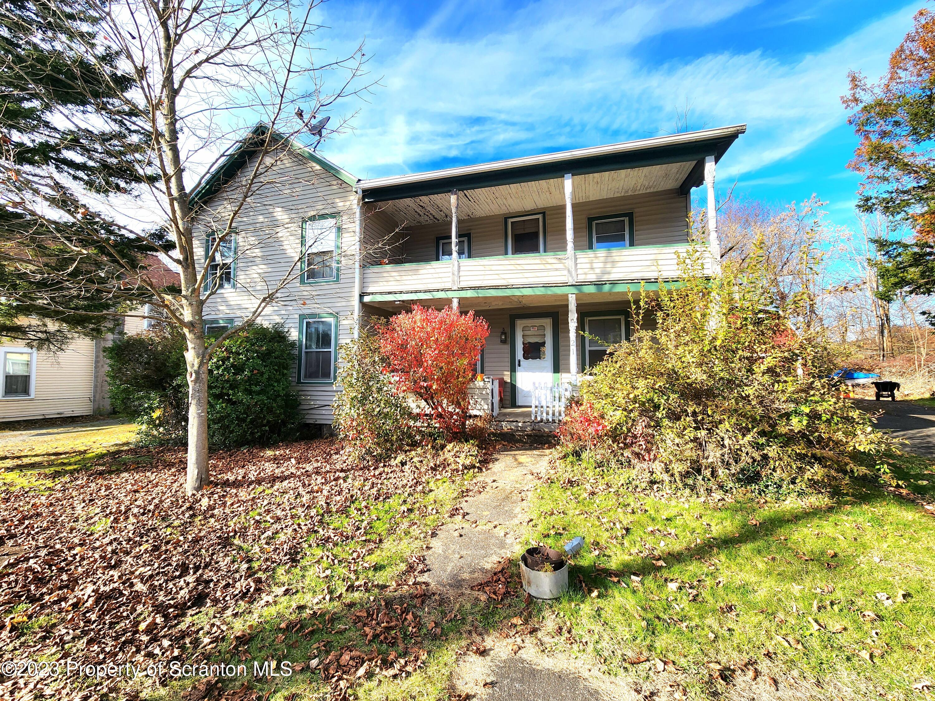 21 High Street Nicholson, PA 18446 - Photo 1 of 33 a front view of a house with a yard