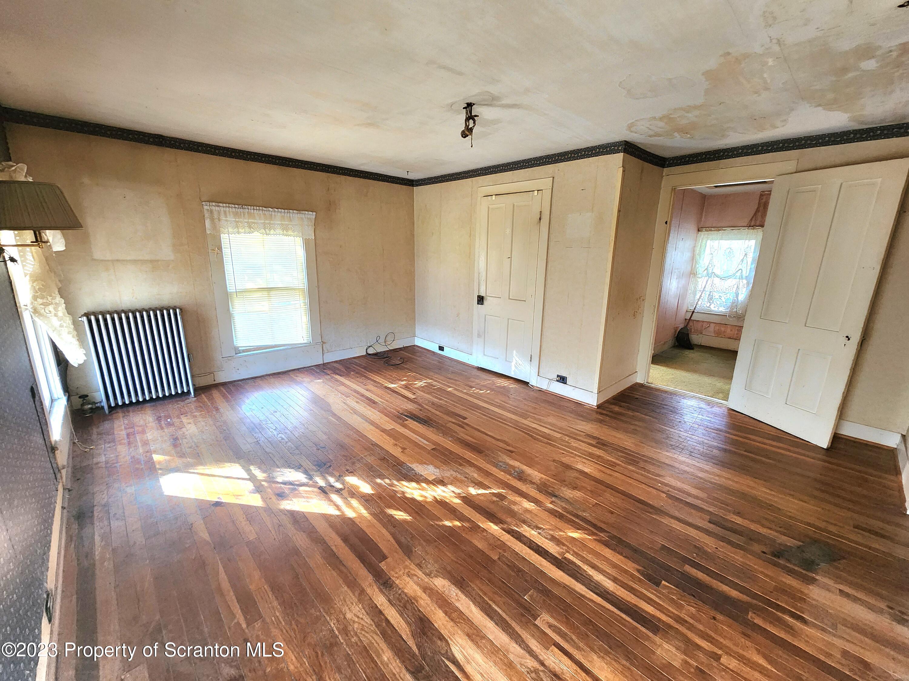 21 High Street Nicholson, PA 18446 - Photo 17 of 33 a view of a livingroom with wooden floor
