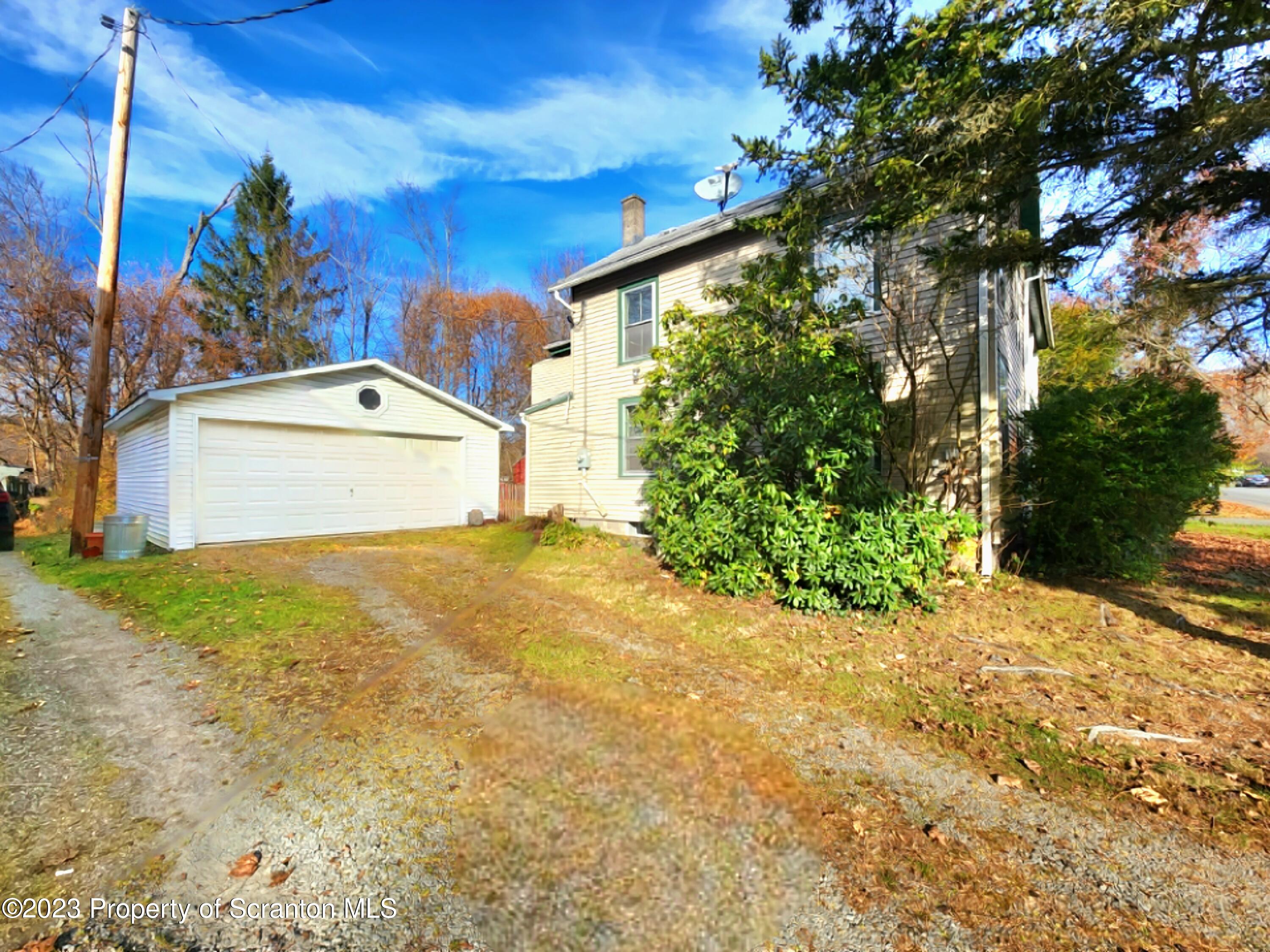 21 High Street Nicholson, PA 18446 - Photo 28 of 33 a front view of a house with a yard
