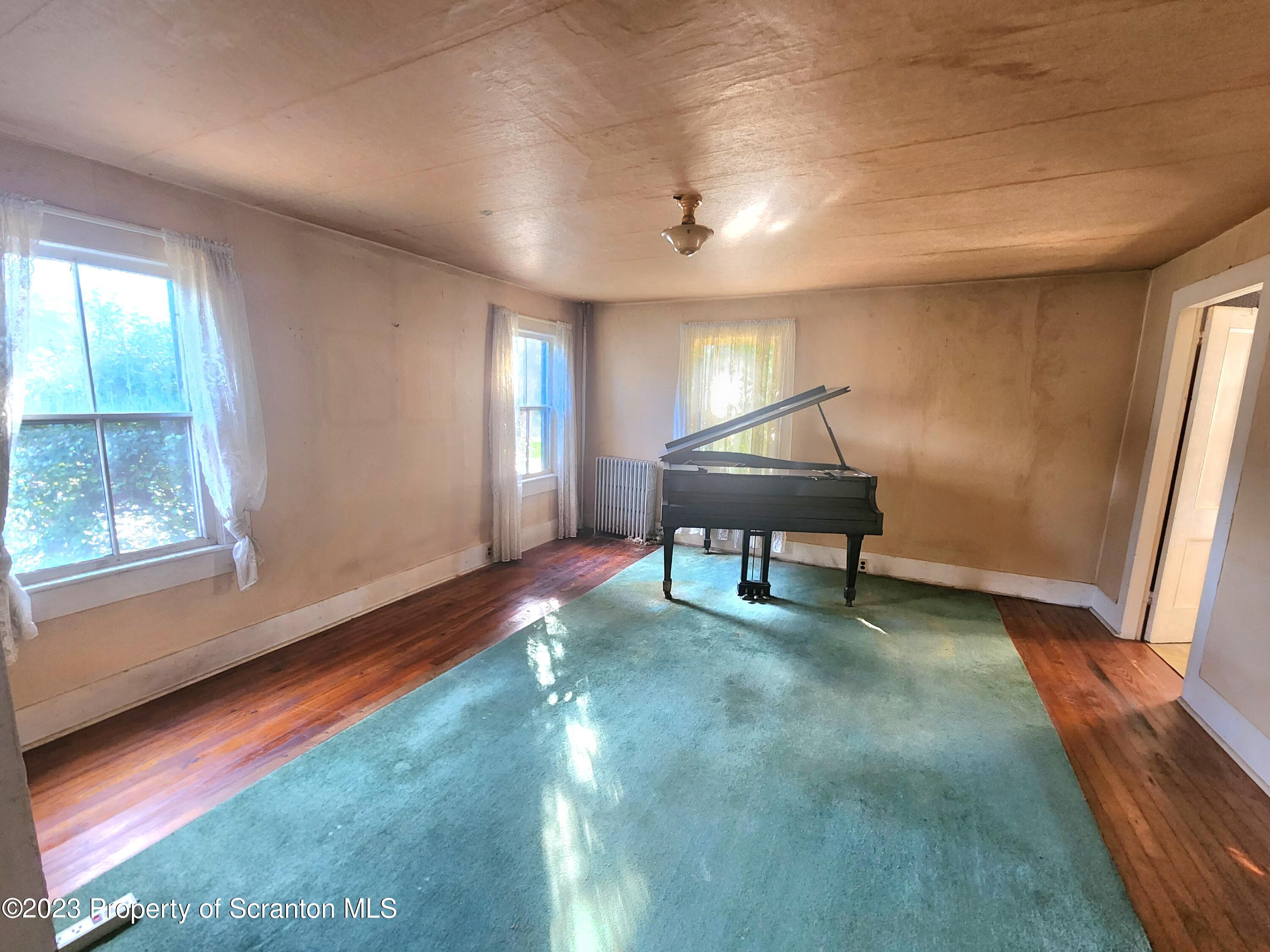 21 High Street Nicholson, PA 18446 - Photo 4 of 33 a room with furniture and a window