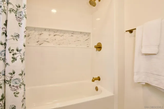 a kitchen with kitchen island a sink stainless steel appliances and cabinets