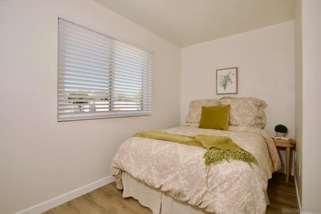 a bedroom with a bed and a closet