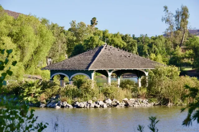 a bench is sitting in middle of the wooden floor